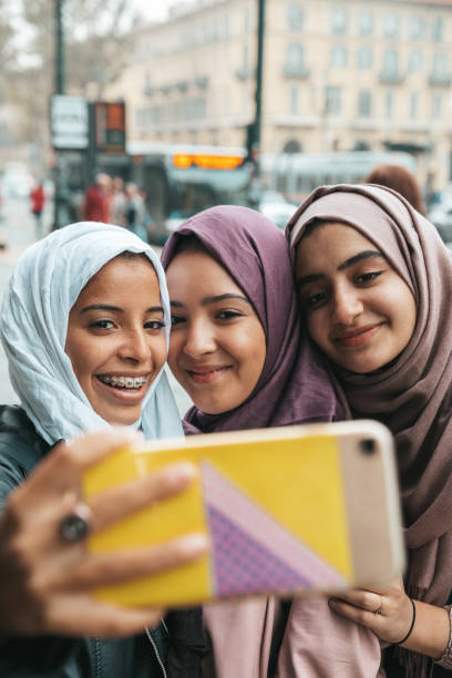 istock Happy friends smiling to camera 1290318711