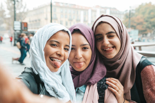 istock Three happy friends smiling to camera 1290318830