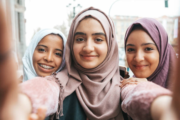 istock Three happy friends smiling to camera 1290318838