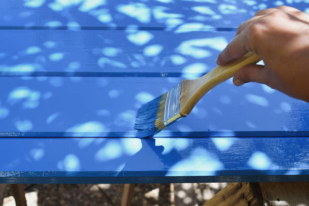 Hand painting wooden board in blue