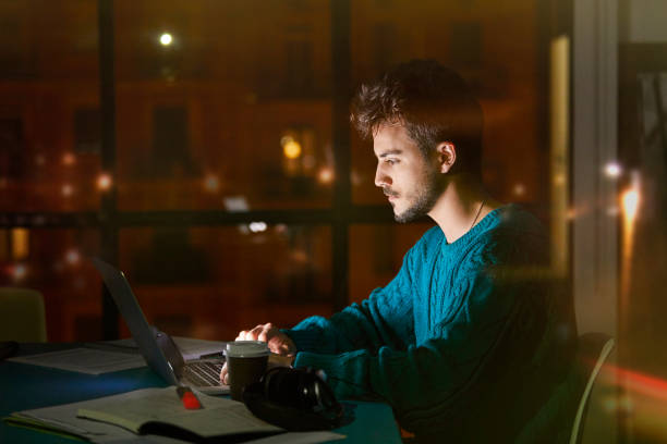 istock Serious Businessman Working Late at the Office 1290320635