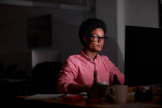 istock Young African American Male Executive Working on Computer 1290320670