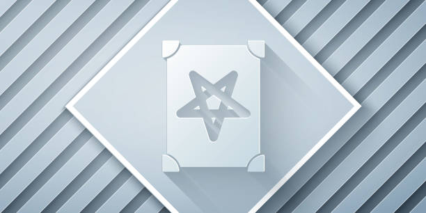 istock Paper cut Ancient magic book with alchemy recipes and mystic spells and enchantments icon isolated on grey background. Paper art style. Vector 1290321847
