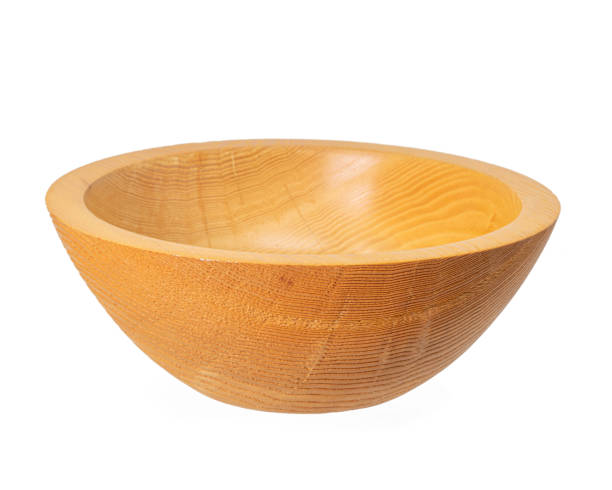 Side view of an empty turned rustic light wooden bowl Side view of an empty turned rustic light wooden bowl isolated on white antique fruit bowl stock pictures, royalty-free photos & images