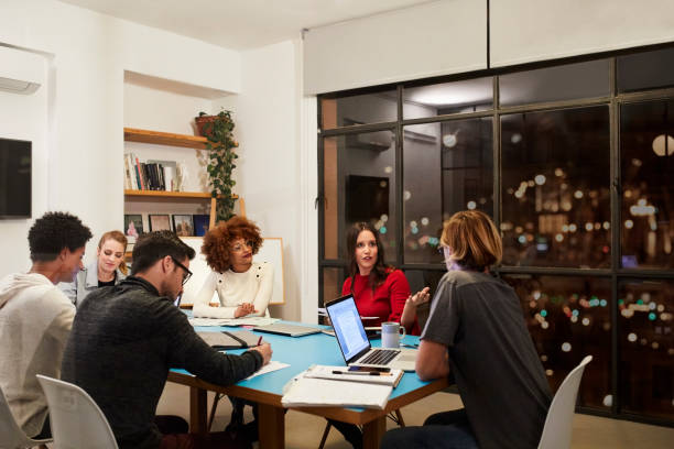 istock Young Professionals are Working Late in Board Room 1290324303