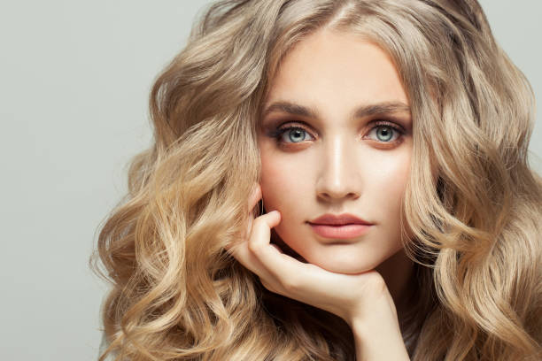 istock Beautiful young face close up on white 1290324629