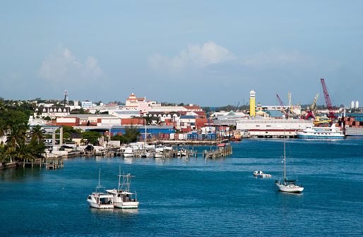 The view of Nassau Harbour drifting boats and Nassau skyline in a background (Bahamas).