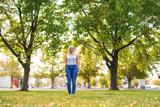 istock Attractive Millennial Female Outdoors in Park Setting Photo Series 1290327158