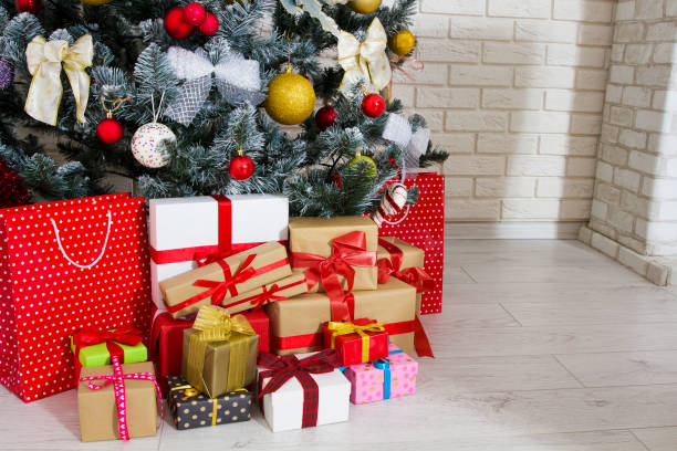 istock Gift boxes under the Christmas tree copy space, New year and christmas concept 1290327417