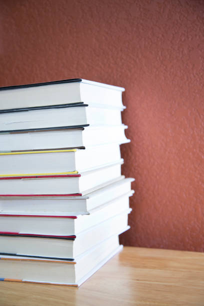istock Textbooks on wooden desk. 1290330493