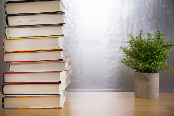 istock Textbooks on wooden desk. 1290330509