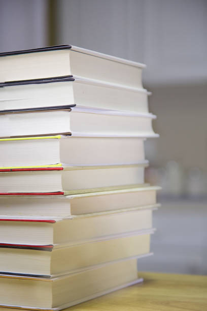 istock Textbooks on wooden desk. 1290330578