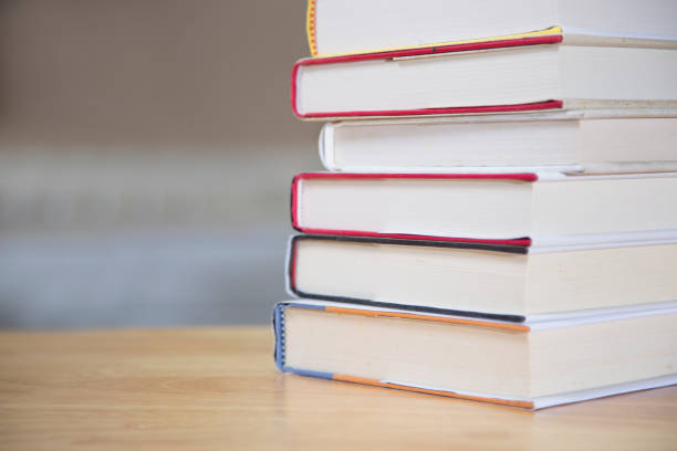 istock Textbooks on wooden desk. 1290330594
