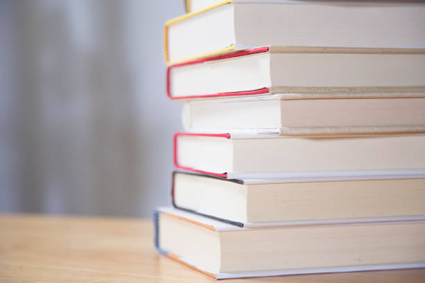 istock Textbooks on wooden desk. 1290330614