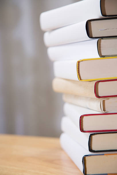 istock Textbooks on wooden desk. 1290330617