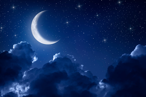 Night sky with moon, clouds and stars