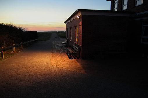 Old motel at the island of Baltrum in sunset