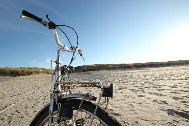 istock Shiny retro bicycle at the sandy beach at the Baltrum 1290332837