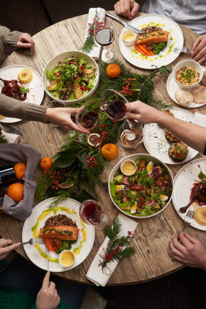 istock Christmas table with food, top view. Friends having dinner 1290332857