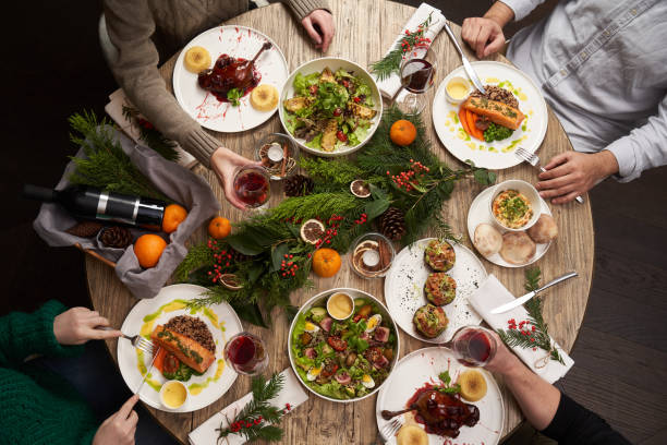 istock Christmas table with food, top view. Friends having dinner 1290332863