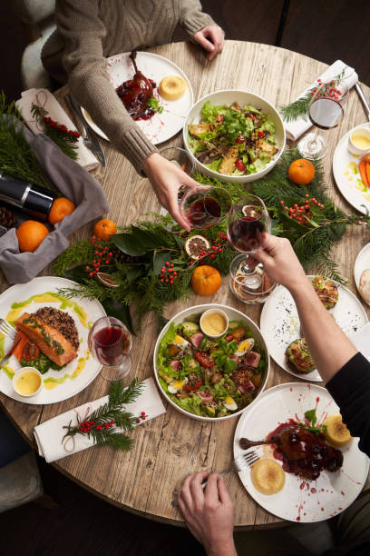 istock Christmas table with food, top view. Friends having dinner 1290332867