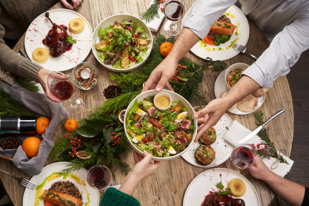istock Christmas table with food, top view. Friends having dinner 1290332874