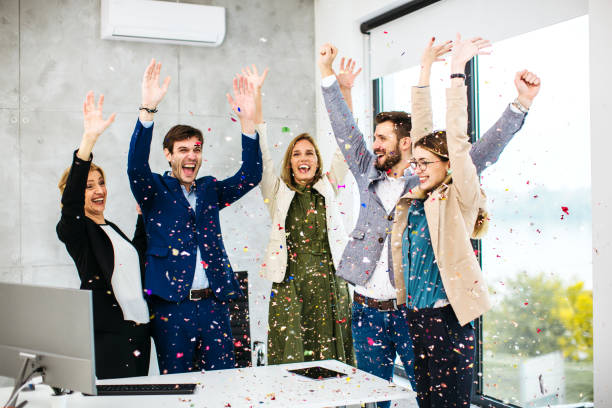 istock Business people celebrating inside modern office 1290334626