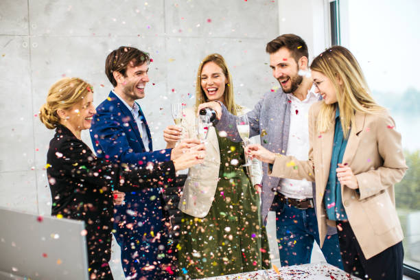istock Business people celebrating inside modern office 1290334649