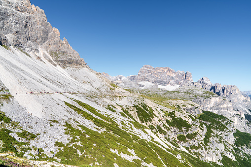 Dolomites, Dolomiti Alps in Italy beautiful mountain summer landscape with high rocky towers on the hiking route trekking around Tre Cime di Lavaredo