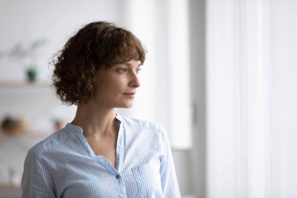 istock Close up thoughtful depressed young woman looking to aside 1290335562