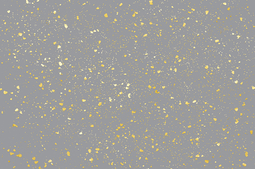 Illuminating Golden particles on holiday Ultimate Gray background. Yellow splats, color of the year 2021.