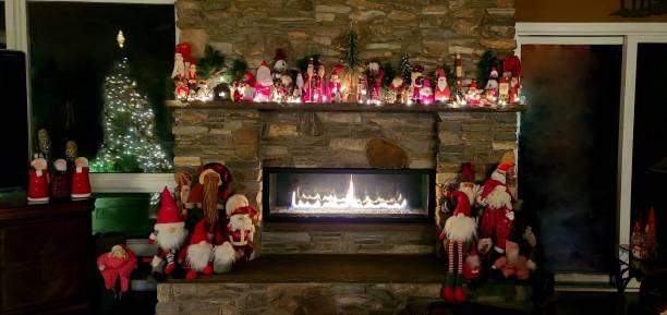 istock Large Stone Fireplace Glowing During the Christmas Holidays 1290339938
