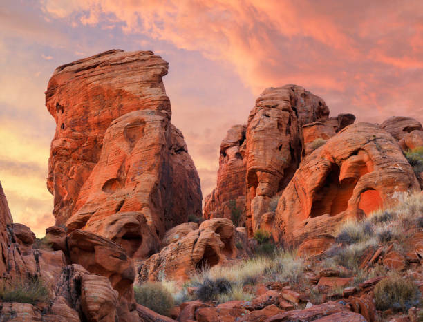 The Wind Blown Rock Formations at Valley of Fire State Park, Nevada, during Suset Wind Blown Sandstone Formations in the Valley of Fire State Park, Nevada at Sunset rock formations stock pictures, royalty-free photos & images