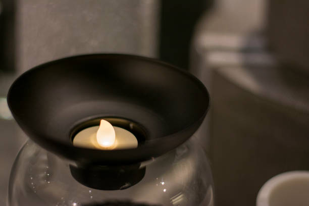 istock Candle in a black candlestick in the interior 1290341467
