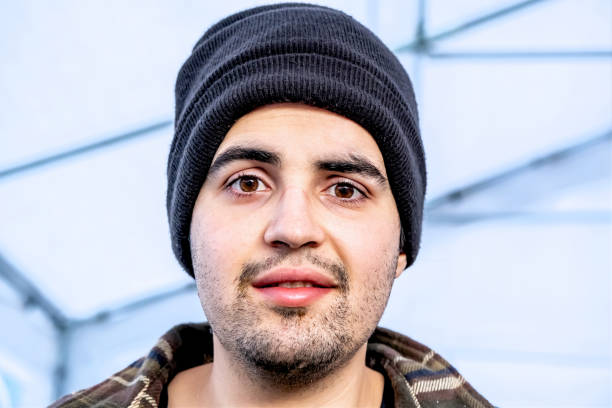 istock Smiling young man wearing a toque hat 1290341679