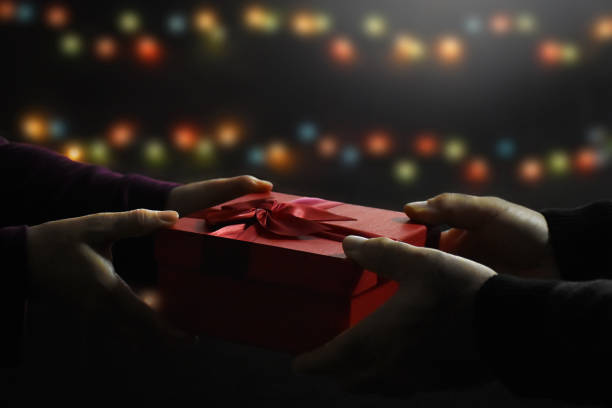 istock Man giving a gift to woman 1290341792