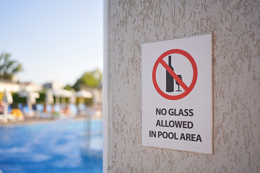 Information sign, at the swimming pool, as a warning that tourist can't bring their beverages