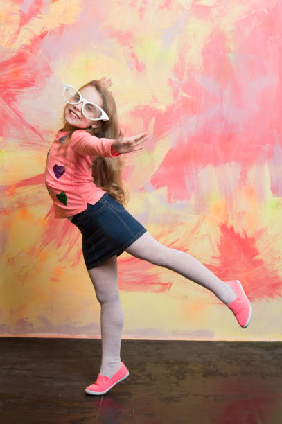 istock Girl doing flying swallow pose 1290347110
