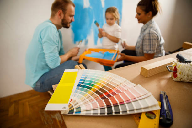 istock Painting a color swatch on the wall 1290351051