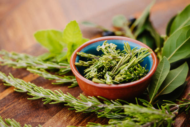istock Different tasty herbs with rosemary in a bowl 1290352726