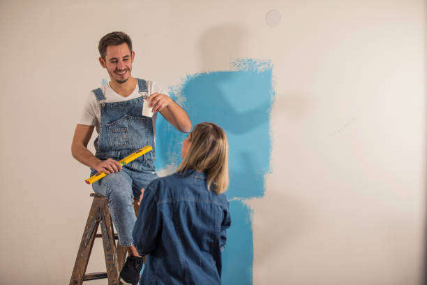 istock Couple on a coffee break while renovating their apartment 1290356617
