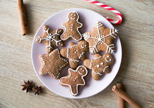 istock Christmas gingerbread men and stars with cinnamon and anise. 1290356708