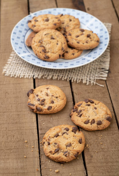istock Chocolate chip cookies on a plate over a wooden table 1290358288