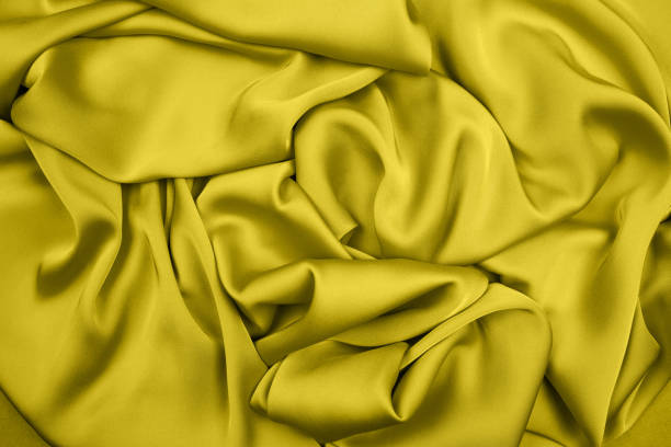 istock Knitted csilk wool texture yellow color. full frame background . close up. copy space. 1290358577
