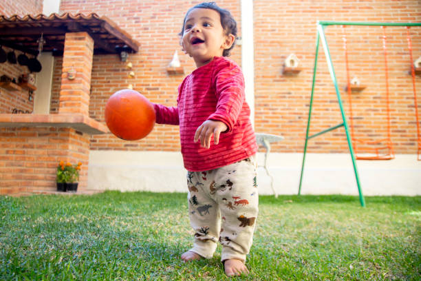 istock Baby in her first steps, in the backyard 1290360127