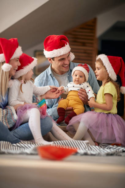 istock Joyful parents spening Christmas time together 1290360612