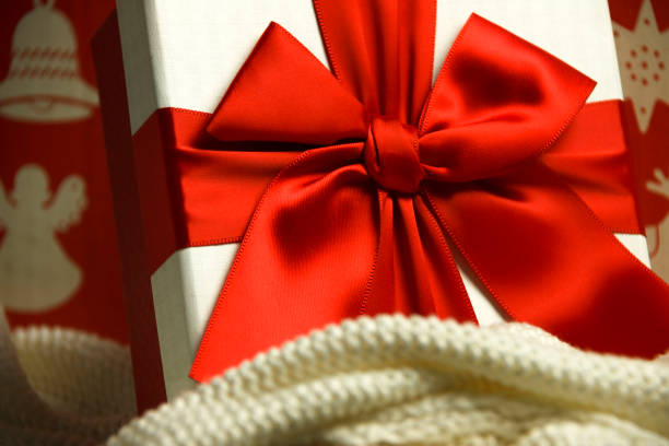 istock Christmas present with red ribbon and bow. 1290360670