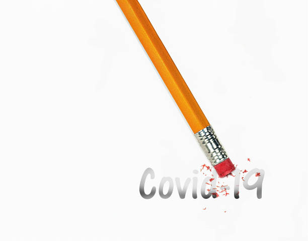 istock pencil eraser erasing Covid-19 word 1290365983