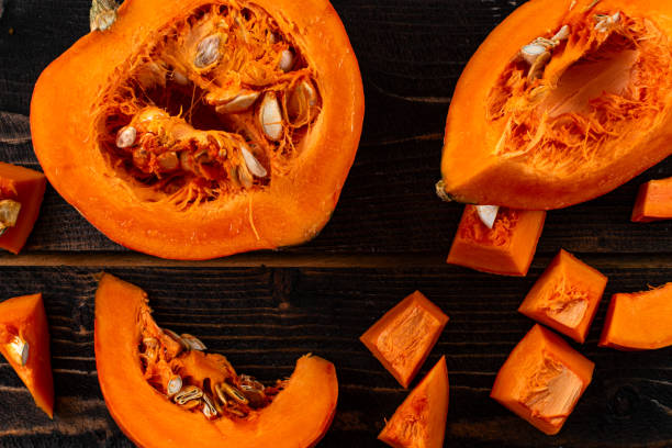 istock chop orange pumpkin on wooden table 1290366501