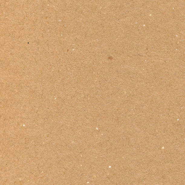 istock Natural recycled beige tan wrapping paper, light brown cardboard texture pattern, rough textured copy space background macro closeup 1290369987